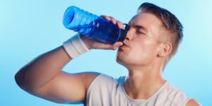 Image of athlete drinking one of the best drinks for energy, LemonAid